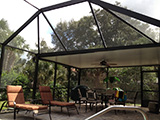 Mansard style pool enclosure with elite roof and fan beams by East Coast Aluminum