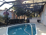 Modified mansard style pool enclosure by East Coast Aluminum