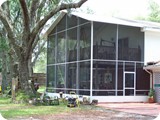 Two story screen enclosure added to Palm Coast home by East Coast Aluminum