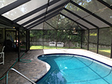 Pool enclosure with gable roof by East Coast Aluminum